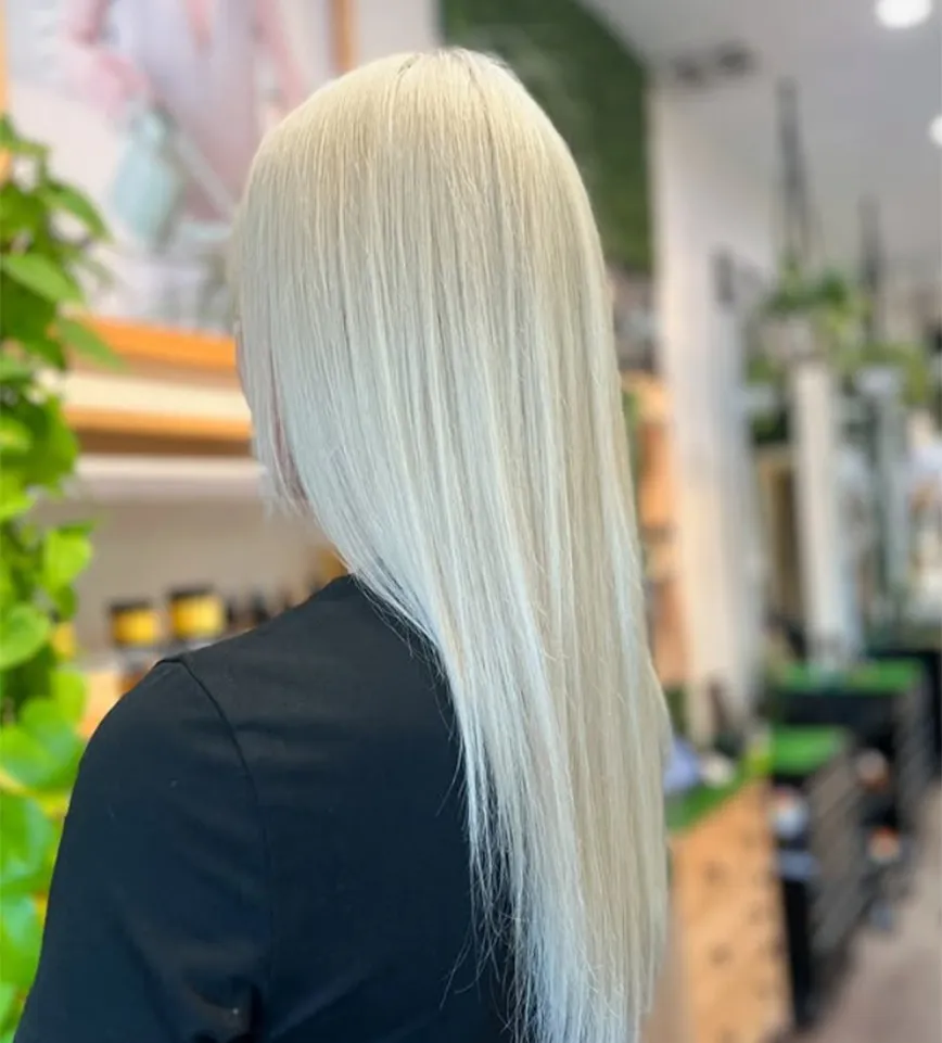 A person seen from behind with long, straight, platinum blonde balayage hair. - Ka'ton Salon, Fort Lauderdale FL