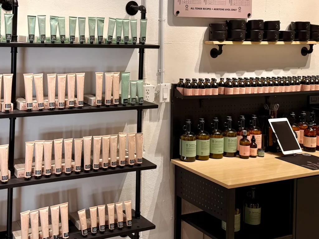 Shelves of hair care products for a balayage salon, with a tablet on the checkout counter. - Ka'ton Salon, Fort Lauderdale FL